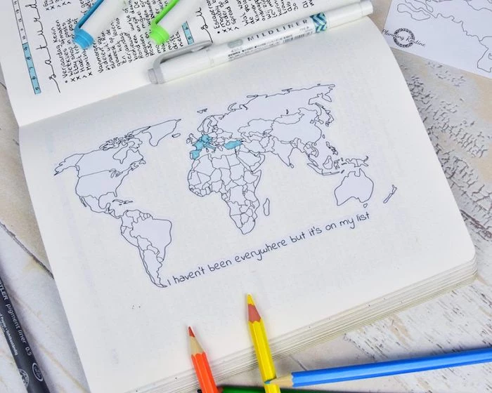 i haven't been everywhere but its on my list written underneath map of the world bullet journal ideas lots of pencils around it