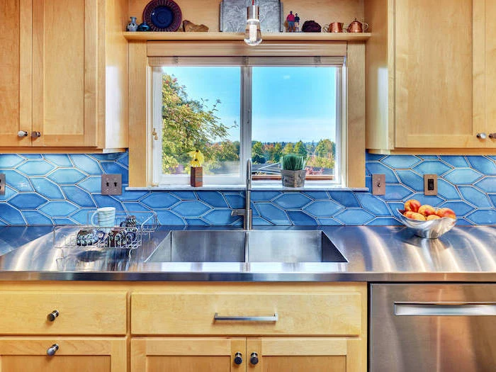 kitchen backsplash ideas tiles in two different shades of blue wooden cabinets with stainless steel countertop small window
