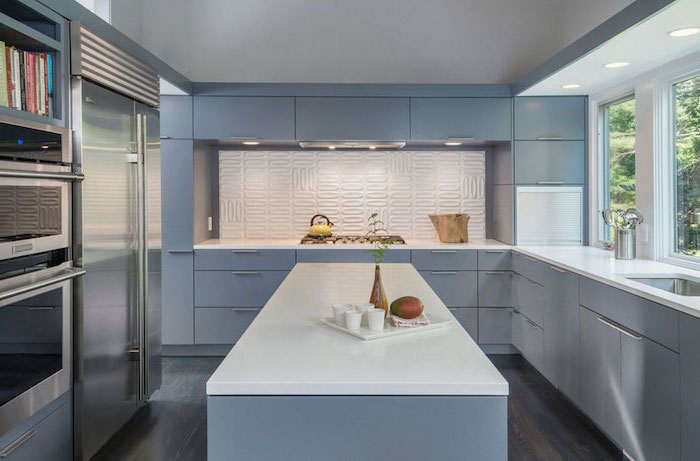 light blue cabinets and kitchen island with white countertops subway tile backsplash white backsplash