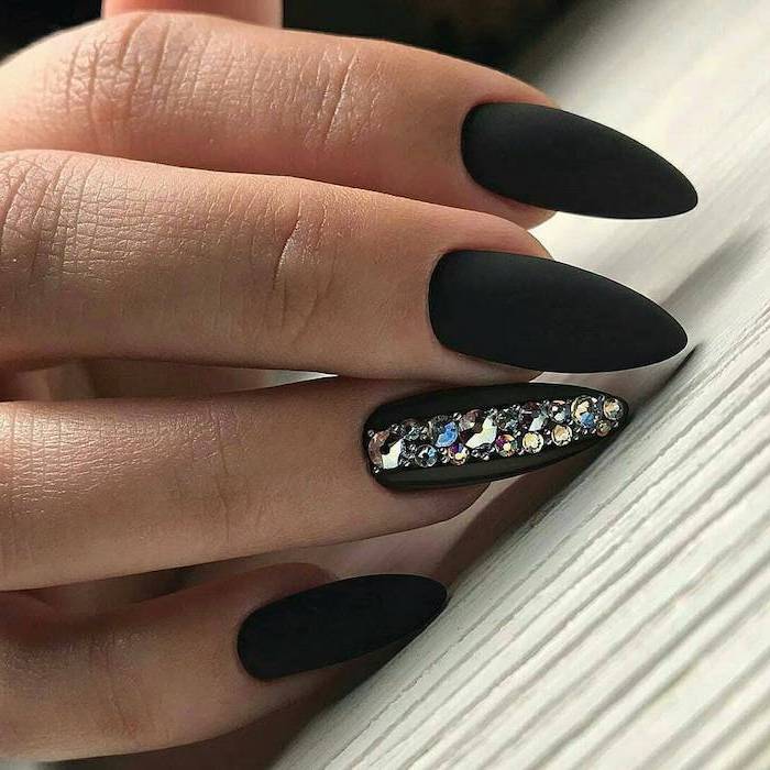 long stiletto nails nail ideas 2020 black matte nail polish rhinestones decoration on the ring finger