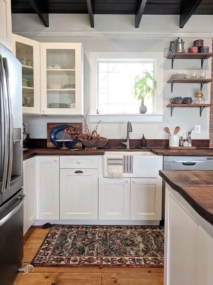 modern farmhouse kitchen decor white cabinets dark wooden countertops open shelving colorful carpet on wooden floor