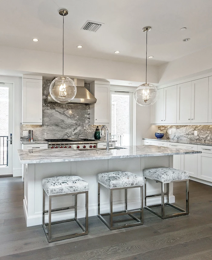 modern kitchen backsplash wooden floor white cabinets and kitchen island marble backsplash and countertops