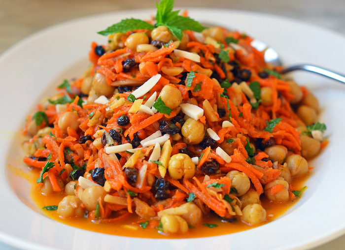 morrocan carrot chickpea salad with citrus almonds gardnished with fresh mint leaves roasted chickpeas recipes