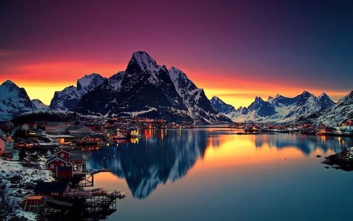 mountain landscape aesthetic computer wallpaper lake at sunset surrounded by small town with small houses