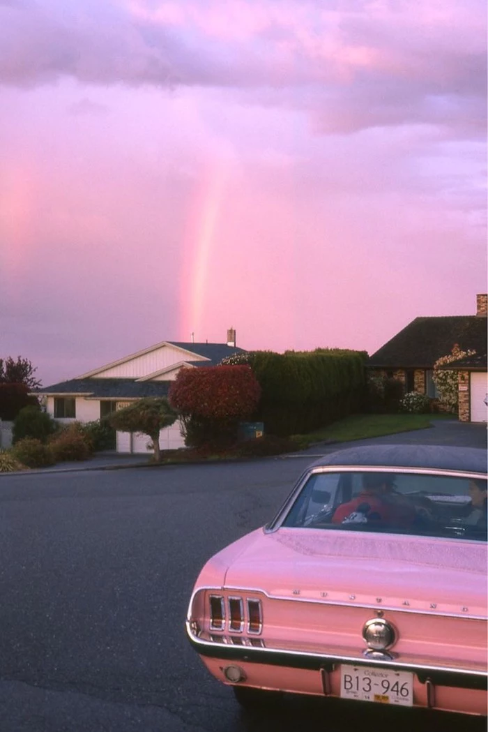 pink car at the forefront cute aesthetic wallpapers houses in the background purple pink sky above them