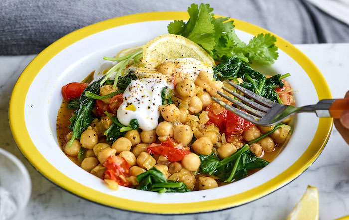 roasted chickpeas recipes chickpea curry with tomatoes and spinach garnished with lemon and parsley