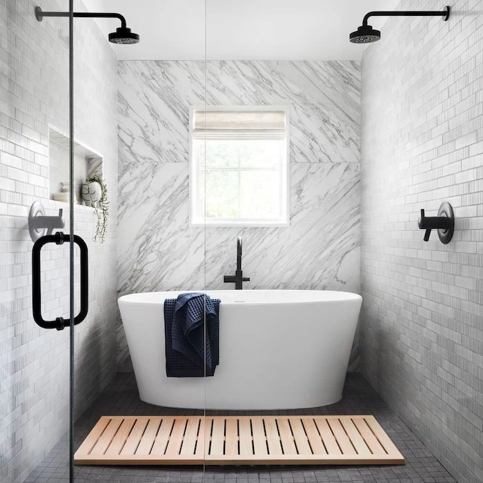 small bathroom remodel ideas marble tiles accent wall black shower heads grey subway tiles white bathtub