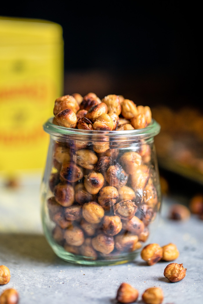 spicy roasted chickpeas with mustard how to roast chickpeas placed inside a glass jar placed on granite surface