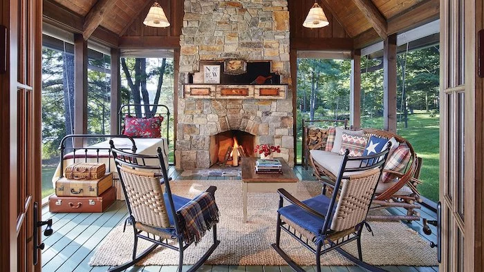 stone fireplace under cathedral ceiling screened in porch ideas bed sofa rocking chairs coffee table arranged in front of fireplace