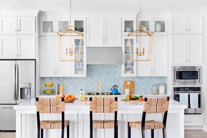 white cabinets and kitchen island kitchen backsplash tile light blue tiles for backsplash white countertops two pendants hanging above the kitchen island