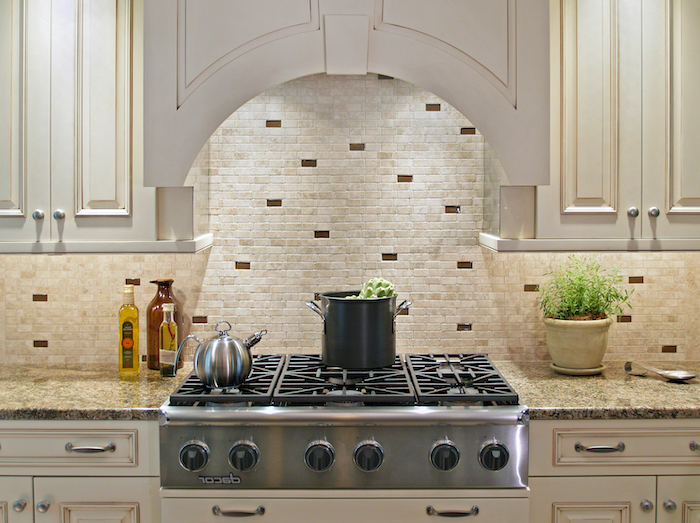 white cabinets granite countertop how to tile a backsplash small stone tiles on the wall in white beige and brown