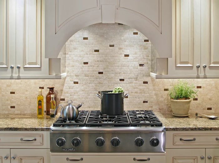 white cabinets granite countertop how to tile a backsplash small stone tiles on the wall in white beige and brown
