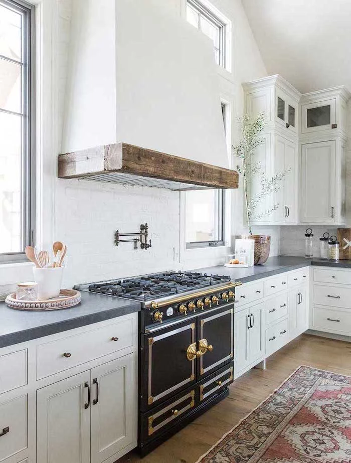 white cabinets with black granite countertop farmhouse kitchen decor ideas black stove colorful carpet on wooden floor