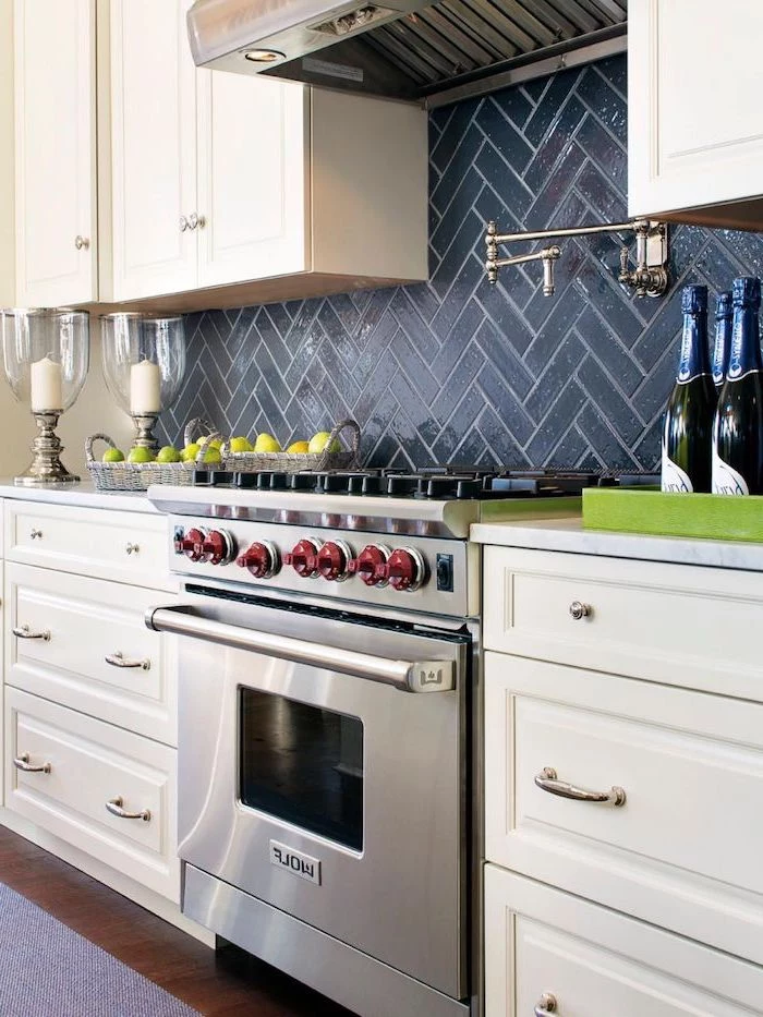 white cabinets with white countertops kitchen backsplash tile black tiles above the stove wooden floor