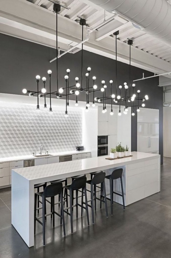 white kitchen island with tall black bar stools around it modern kitchen backsplash white cabinets white countertops white tiled backsplash