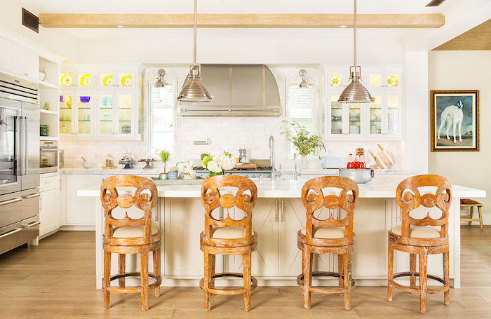 white kitchen island with wooden bar stools farmhouse white kitchen cabinets marble countertops wooden floor