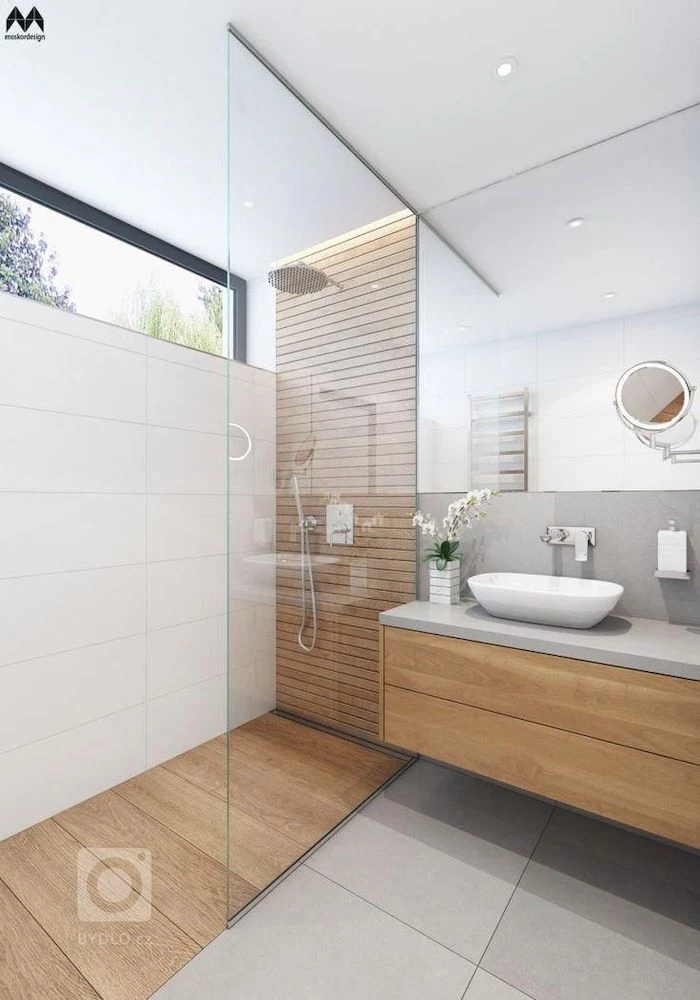 white tiles on the wall and floor wooden accent wall and floor in the shower floating cabinet with large mirror