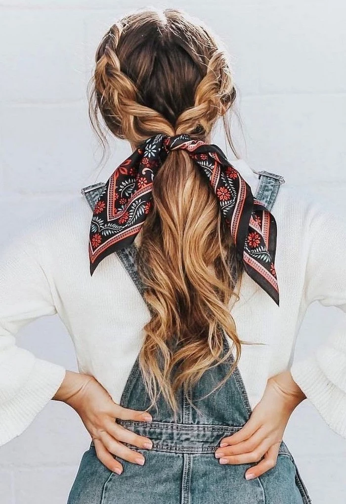 woman wearing white blouse denim overalls cute hairstyles for girls brunette hair with blonde highlights in two braids tied with a silk scarf