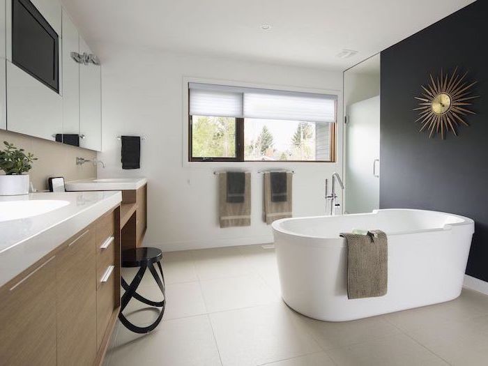 wooden floating cabinets with two sinks large mirror above them bathroom ideas photo gallery black accent wall white bathtub beige tiles on the floor