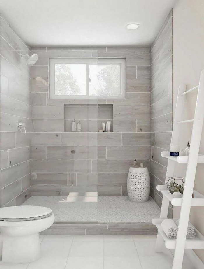 wooden walls in the shower cabin white tiles on the floor how to decorate a bathroom white shelves leaning on white wall