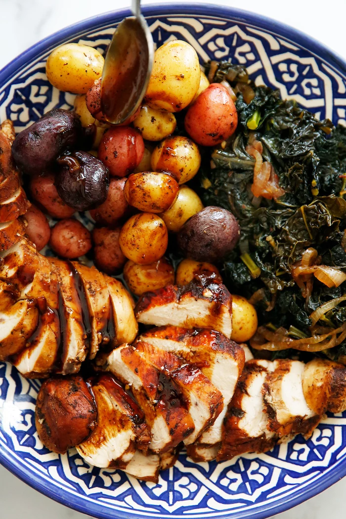 balsamic chicken breast with side of roasted potatoes cooked kale instant pot recipes blue and white ceramic plate