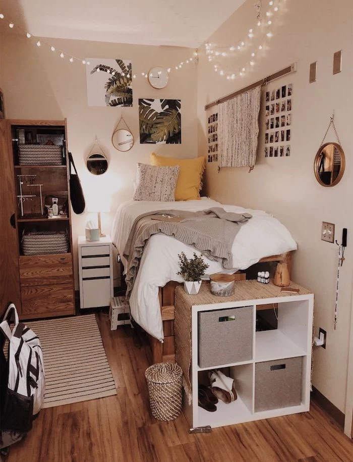 bed made of palettes white walls with art and polaroids on it teenage girl bedroom ideas for small rooms fairy lights hanging from the ceiling
