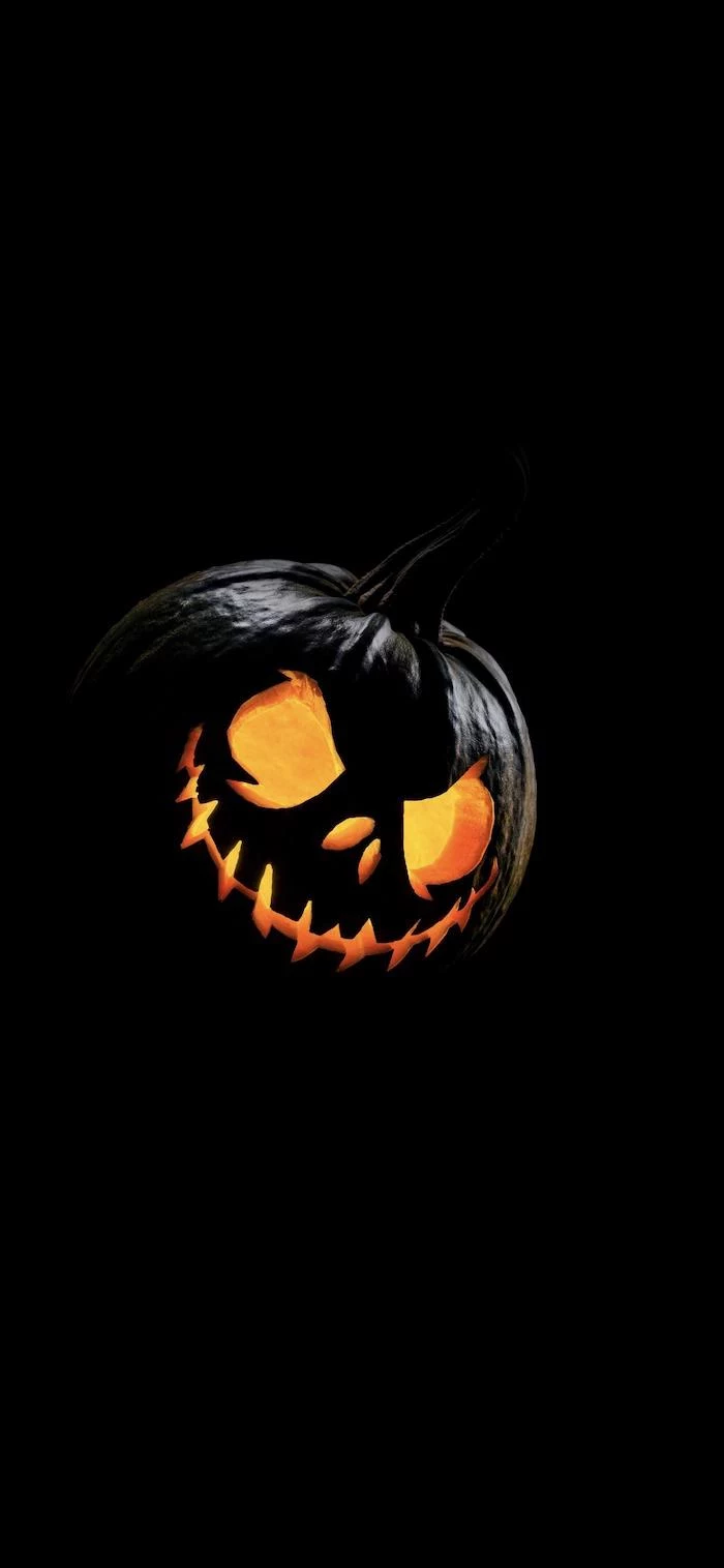 black background halloween background images jack o lanterns with scary expression painted in black