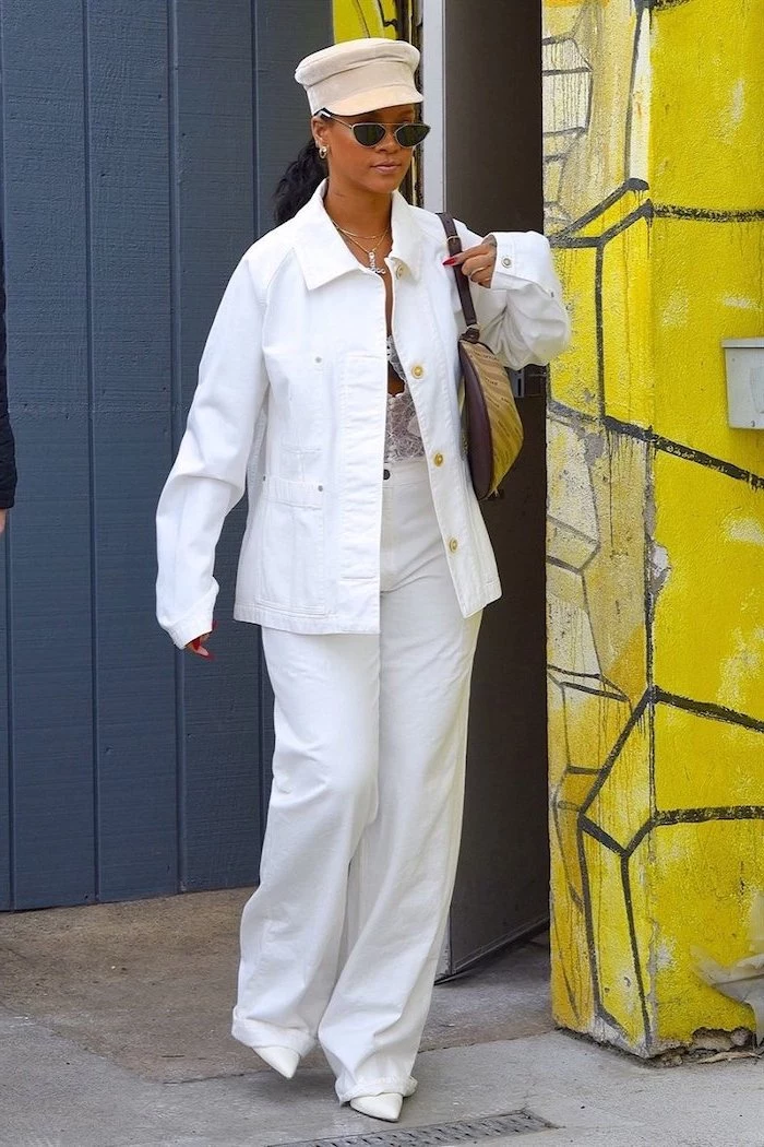 black haired rihanna wearing all white cute outfit ideas white jeans white denim jacket hat white shoes sunglasses
