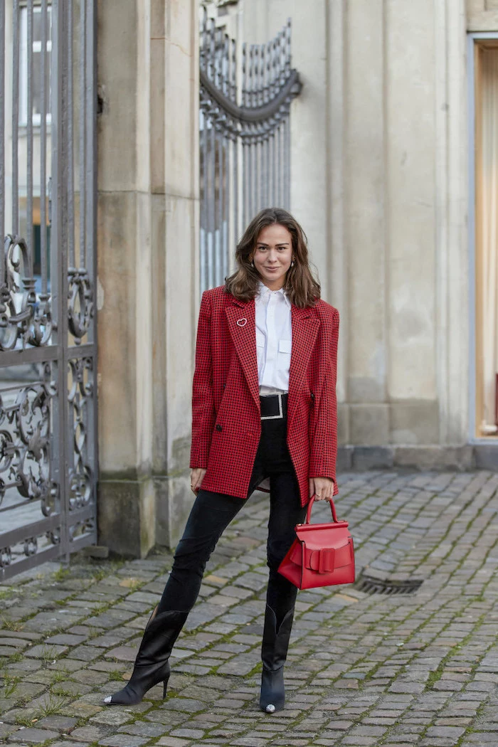 black jeans white t shirt black leather boots red over sized blazer and bag cute outfit ideas for girl worn by woman with shoulder length brown hair
