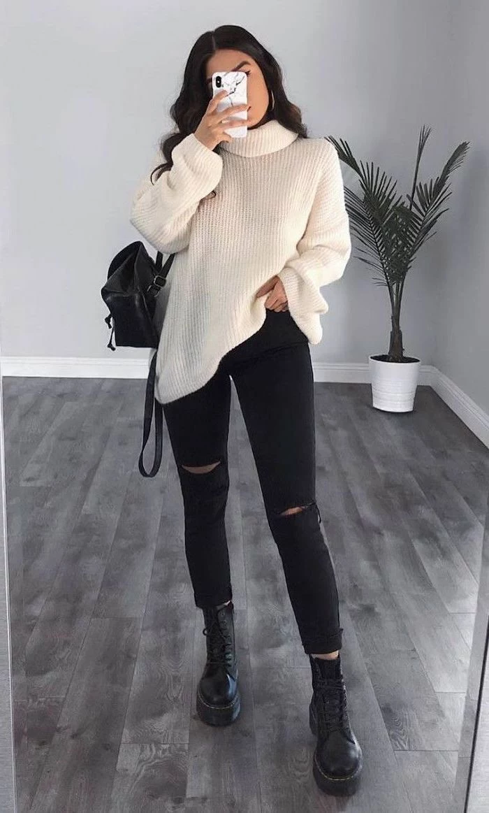 black jeans with white oversized sweater cute outfits for women black combat boots worn by woman with long black hair