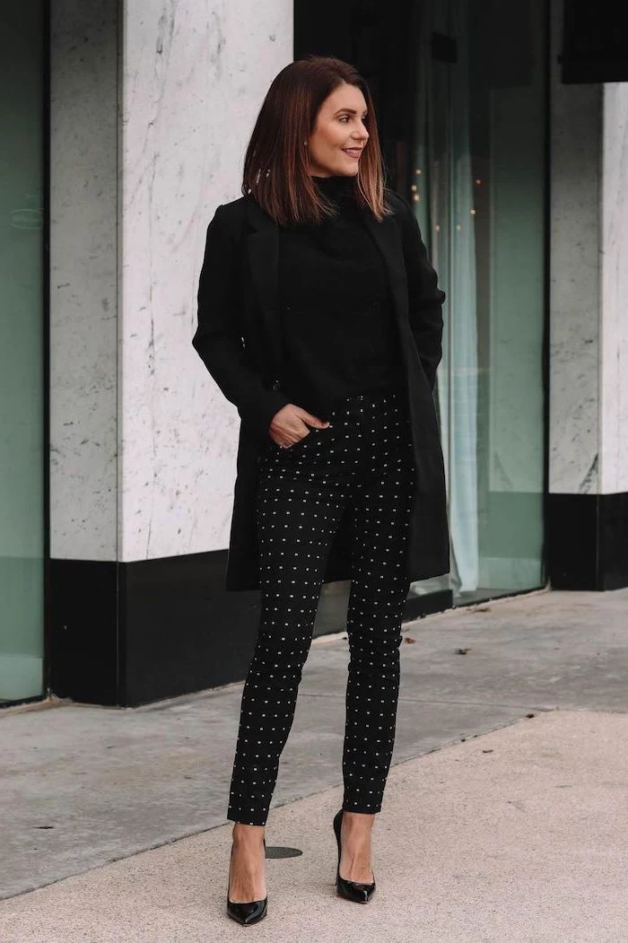black outfit worn by woman with shoulder length brown hair cute outfits for women black trousers with white dots black blouse coat and shoes