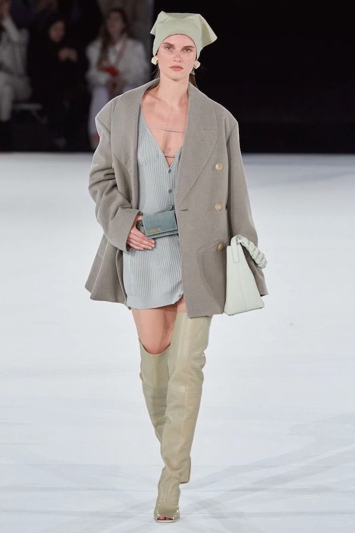 blue knitted dress grey coat thigh high leather boots cute trendy outfits worn by model walking down the runway