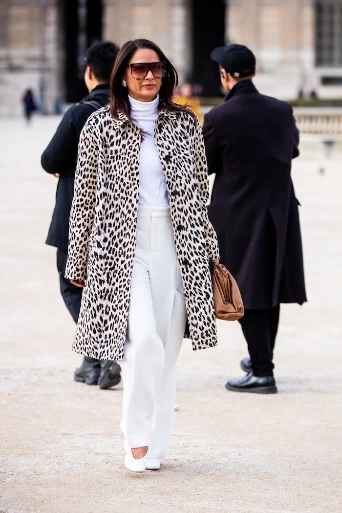 brunette woman with sunglasses walking down the street pinterest cute outfits white blouse trousers shoes leopard print coat