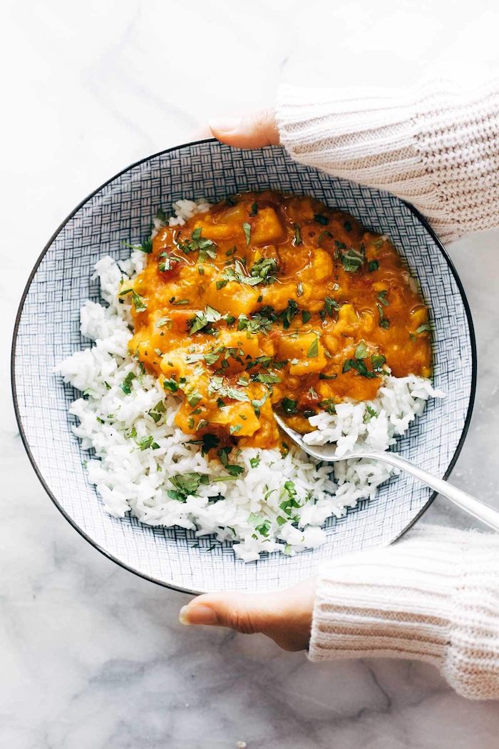 cauliflower curry instant pot one pot meals white rice with chopped parsley inside black and white ceramic bowl