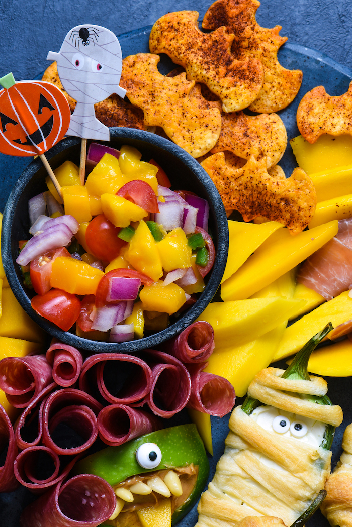 crackers in the shape of bats salad with mango cherry tomatoes onion easy halloween appetizers salami peppers wrapped in dough