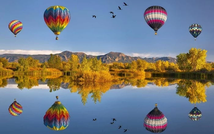 fall desktop backgrounds four hot air balloons flying over a lake surrounded by trees mountain range in the background
