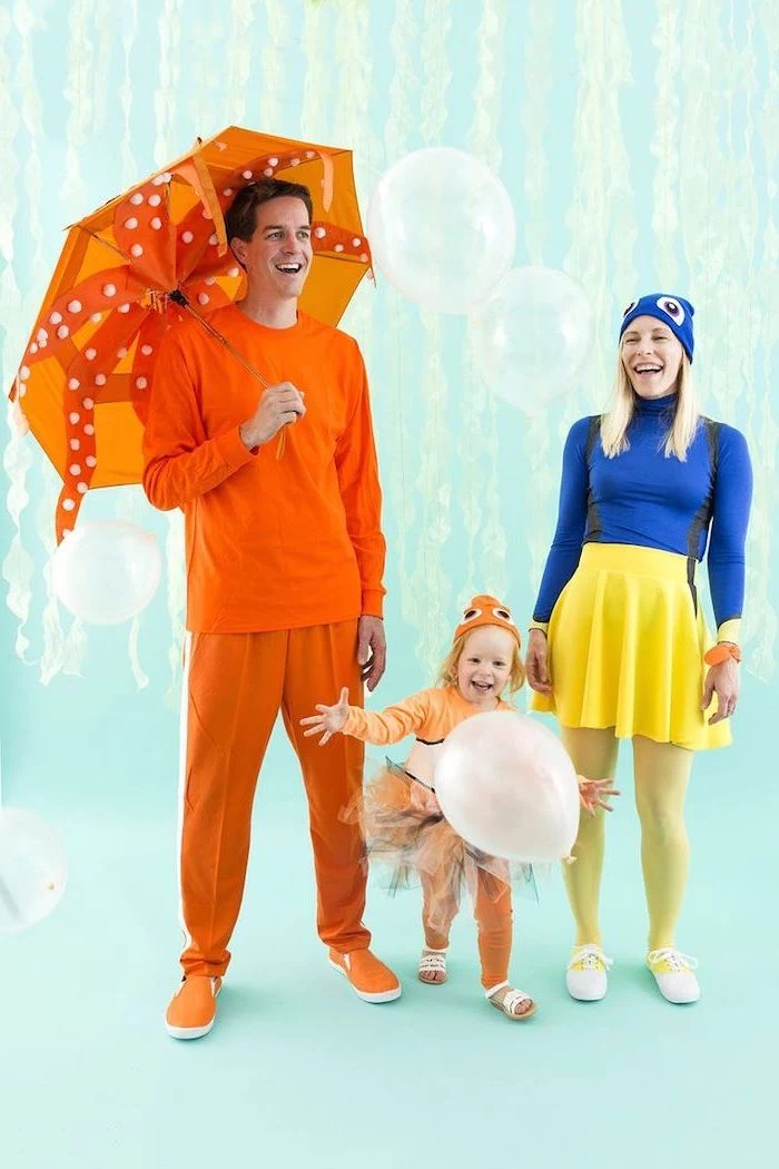 family halloween costume ideas finding nemo costumes baby dressed as nemo mom dressed as dory photographed on light blue background