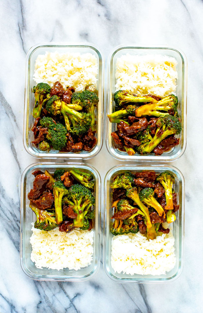 four glass boxes filled with beef and broccoli and white rice placed on marble surface best instapot recipes meal prep