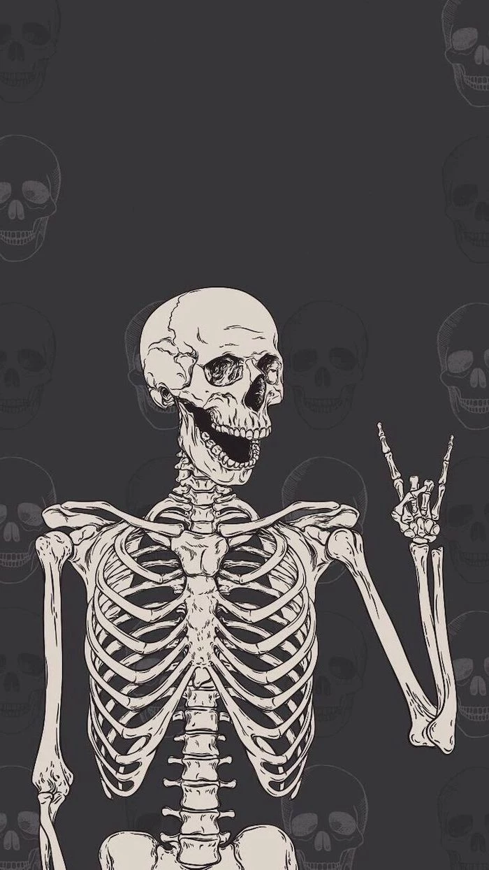 halloween desktop backgrounds dark gray background with skulls skeleton showing the rock sign at the forefront