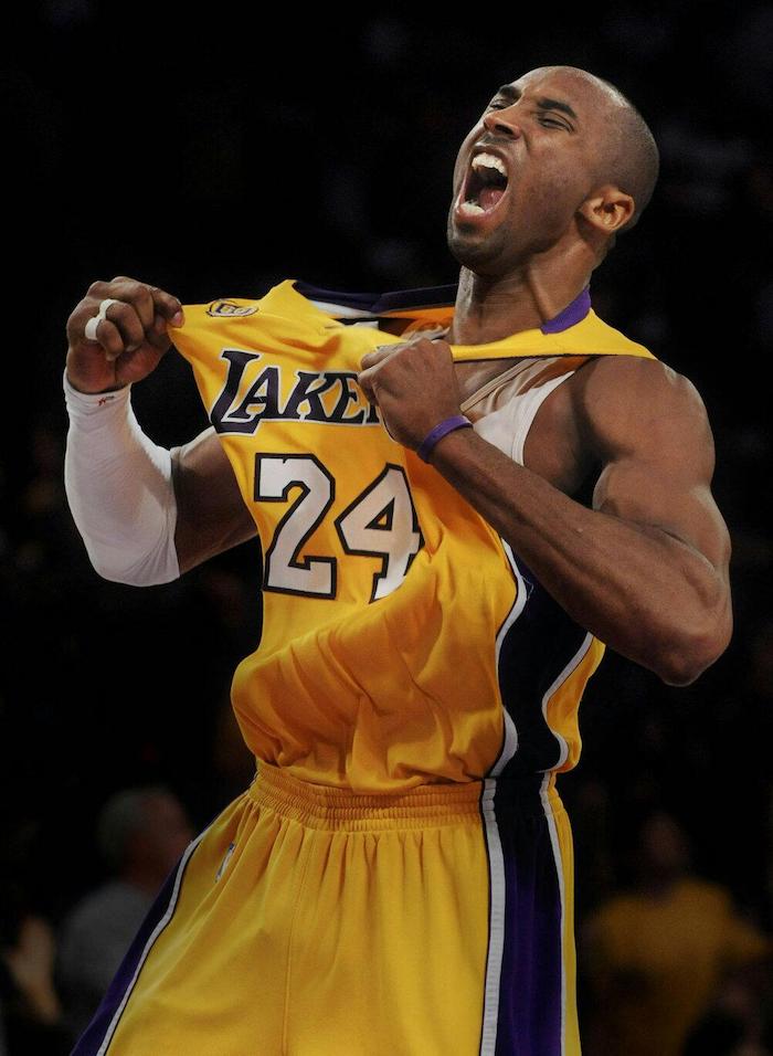 iconic kobe photo of him tugging on his lakers jersey yelling iphone kobe bryant wallpaper wearing white arm sleeve