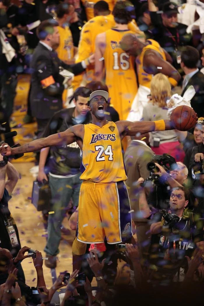 kobe bryant standing on the announcers table holding a basketball cool kobe bryant wallpapers surrounded by people confetti falling down