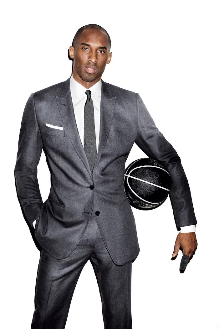 kobe bryant wallpaper hd kobe wearing gray suit white t shirt gray tie holding black basketball on white background
