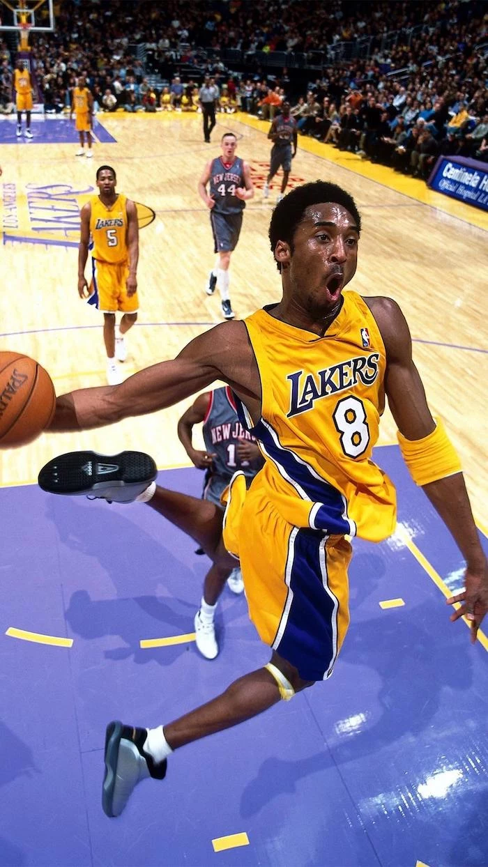 kobe jumping in the air holding a basketball about to dunk it in the basketball hoop iphone kobe bryant wallpaper lakers court