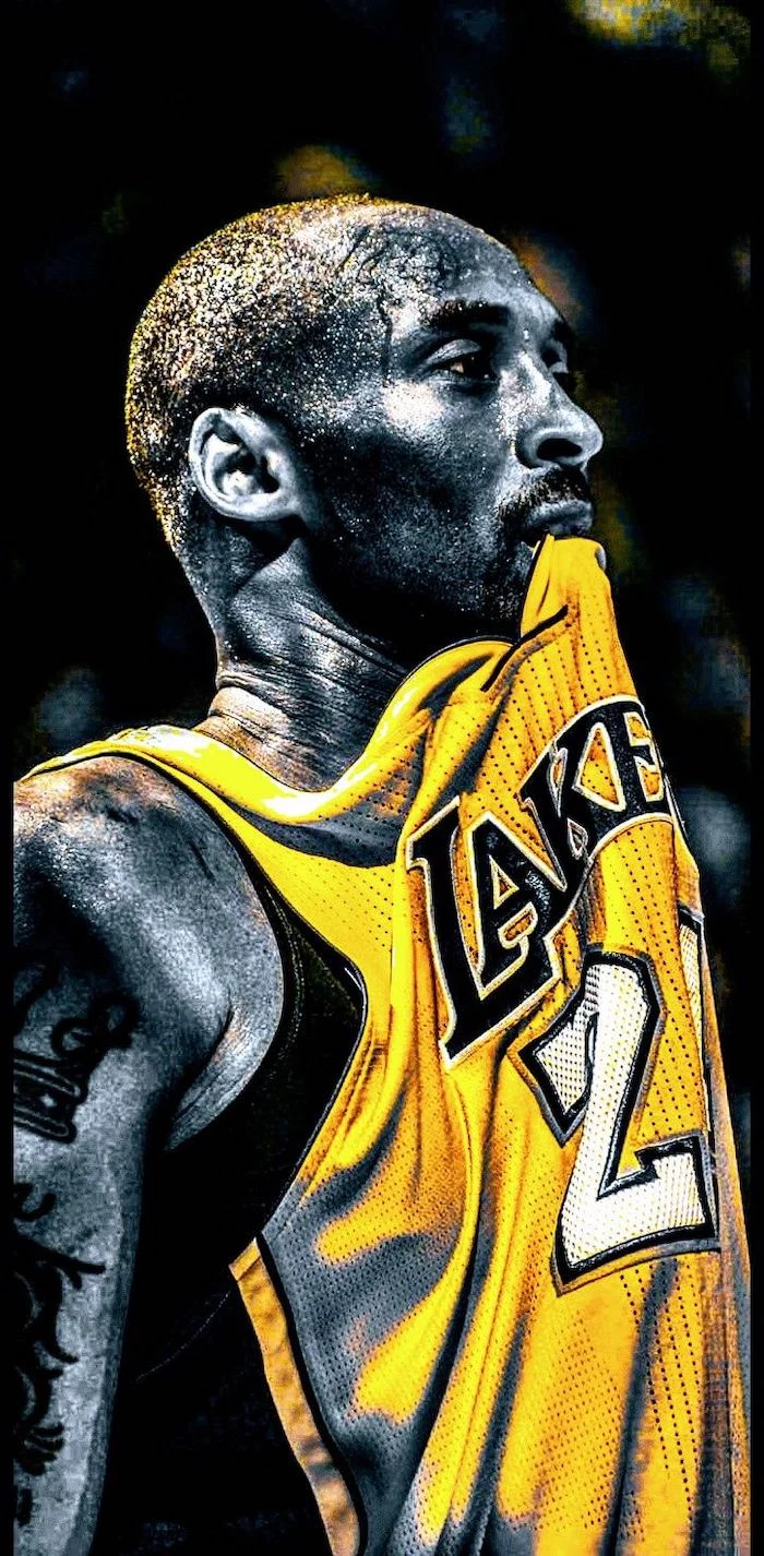 lakers wallpaper black and white photo of kobe wearing yellow lakers jersey biting it sweat dripping down his face