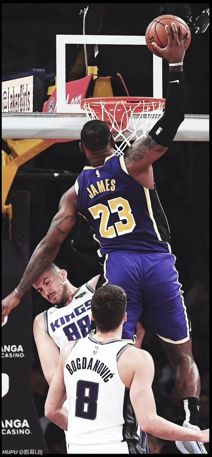lebron james lakers wallpaper wearing lakers uniform jumping in the air about to dunk the ball