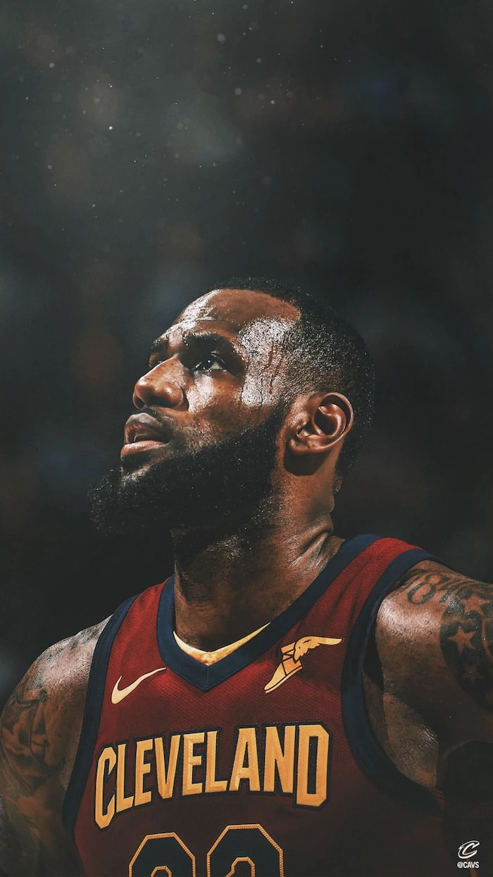 lebron james pictures photo of lebron wearing cleveland cavaliers uniform on the court blurred background