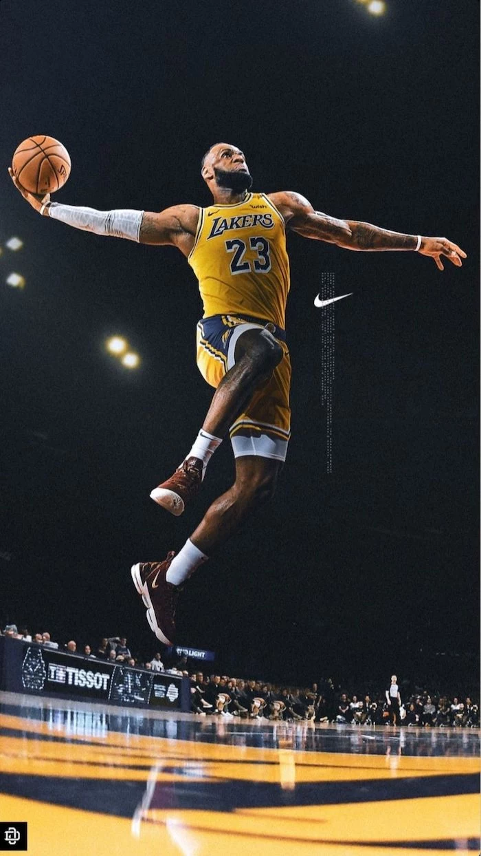 lebron james wearing lakers uniform jumping in the air about to dunk the ball lebron james pictures nike logo on the side