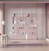 light pink bookcase with cabinets and shelves in different shapes bookcase ideas white curtain behind it small white desk and chair at the front