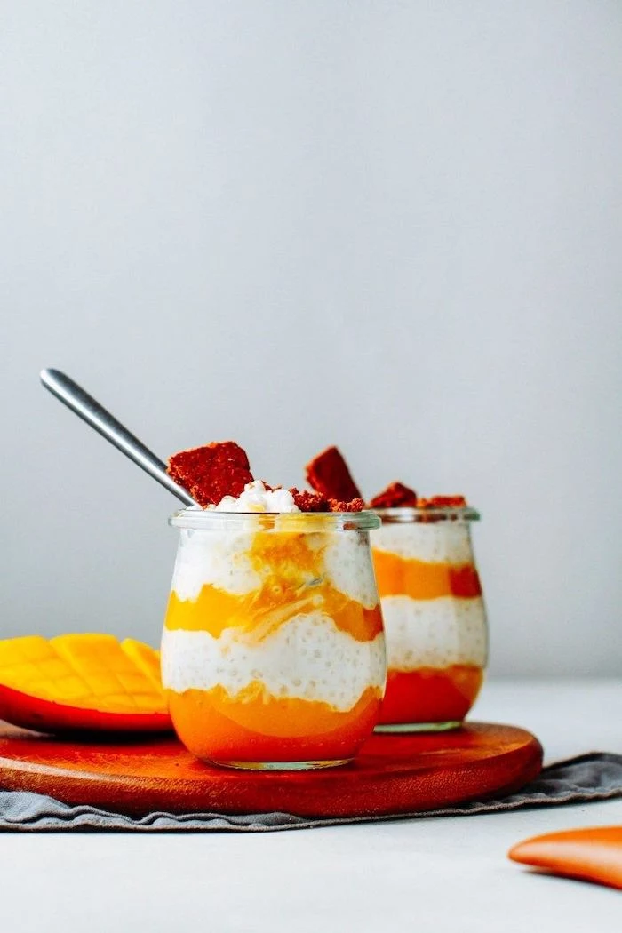 parfait with mango coconut and tapioca pearls how to make tapioca pearls placed inside glasses on wooden cutting board