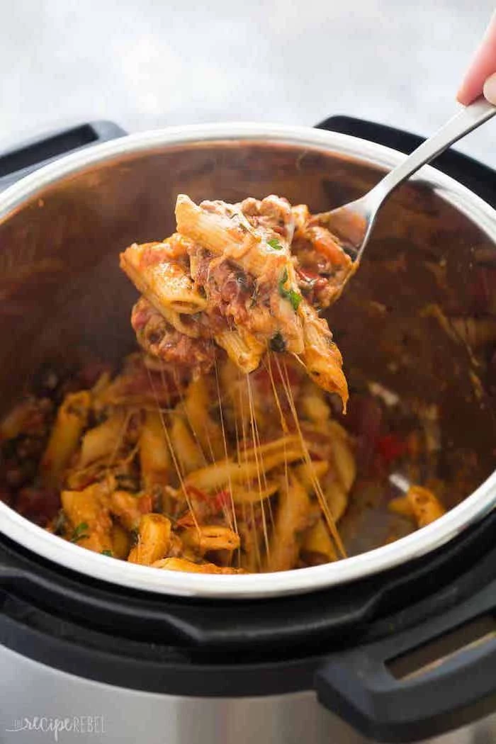 pasta with beef and parmesan cheese cooked inside instant pot instant pot recipes scooped with a fork